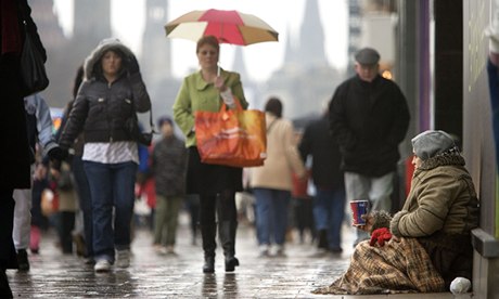 The city and the city  a woman begs on Princes Street in Edinburgh.
